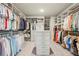 Spacious walk-in closet with custom shelving and plenty of storage at 10265 Grandview Sq, Johns Creek, GA 30097