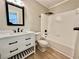 Bright bathroom featuring a white vanity and a full bath with modern fixtures at 134 Carrollwood Dr, Fayetteville, GA 30215