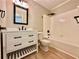 Updated bathroom with a white vanity and bath tub at 134 Carrollwood Dr, Fayetteville, GA 30215