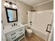 Bathroom featuring a modern vanity with black fixtures and a shower-tub combo at 134 Carrollwood Dr, Fayetteville, GA 30215