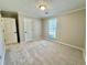 Spacious carpeted bedroom with a window and recessed ceiling lighting at 134 Carrollwood Dr, Fayetteville, GA 30215