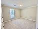 Bedroom with carpet and ample natural light at 134 Carrollwood Dr, Fayetteville, GA 30215