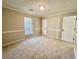 Bedroom with carpet and ample natural light at 134 Carrollwood Dr, Fayetteville, GA 30215