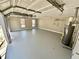 Large three-car garage with windows, providing natural light and space at 134 Carrollwood Dr, Fayetteville, GA 30215