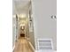 Hallway with hardwood floors leading to bathroom at 134 Carrollwood Dr, Fayetteville, GA 30215