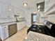 Modern kitchen featuring stainless steel appliances, granite countertops, and tile backsplash at 134 Carrollwood Dr, Fayetteville, GA 30215