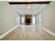 Spacious living room features wood floors, a stone fireplace and ample natural light at 134 Carrollwood Dr, Fayetteville, GA 30215