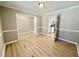 Bright living room with hardwood floors, fresh paint and a seamless transition to the kitchen at 134 Carrollwood Dr, Fayetteville, GA 30215
