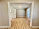 Inviting living room with wood floors, view of the kitchen, and plenty of natural light at 134 Carrollwood Dr, Fayetteville, GA 30215