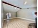 Spacious living room with vaulted ceilings, wood beam and wood-look flooring at 134 Carrollwood Dr, Fayetteville, GA 30215