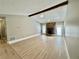 Large living room with a stone fireplace, wood floors, a ceiling fan, and plenty of natural light at 134 Carrollwood Dr, Fayetteville, GA 30215