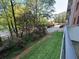 Private balcony showcasing a view of landscaped grounds and parking at 300 Johnson Ferry Rd # B105, Atlanta, GA 30328