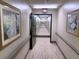 Hallway illuminated with recessed lights and decorative artwork on the walls at 300 Johnson Ferry Rd # B105, Atlanta, GA 30328