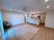 Spacious living room with hardwood floors and an open layout connected to a kitchen at 300 Johnson Ferry Rd # B105, Atlanta, GA 30328