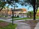 Community pool area surrounded by lush landscaping, trees and building at 300 Johnson Ferry Rd # B105, Atlanta, GA 30328