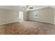 Large open bedroom with plush carpet and a ceiling fan at 4716 Alpine Sw Dr, Lilburn, GA 30047