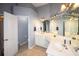 Bright main bathroom with double sinks, tile flooring, plenty of counterspace, and a separate room for the toilet at 794 Lucas Dr, Hampton, GA 30228