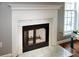 Elegant fireplace with white marble and classic design, adding warmth and style to the room at 794 Lucas Dr, Hampton, GA 30228