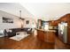 Open concept, large kitchen with hardwood floors, granite countertops and a large island at 794 Lucas Dr, Hampton, GA 30228