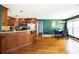 Open concept kitchen with granite countertops, stainless steel appliances, and hardwood flooring at 794 Lucas Dr, Hampton, GA 30228