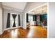 Open concept floor plan leading to an office with hardwood floors and lots of natural light at 794 Lucas Dr, Hampton, GA 30228