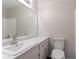 Bathroom featuring a large mirror, vanity with marble countertop, and neutral color scheme at 842 Brighton Dr, Lawrenceville, GA 30043