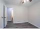Bedroom showcasing doorway to the en-suite bathroom and wood-look flooring at 842 Brighton Dr, Lawrenceville, GA 30043
