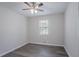 Bright bedroom featuring wood-look flooring, a window with blinds, and neutral paint at 842 Brighton Dr, Lawrenceville, GA 30043