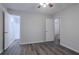 Bedroom featuring wood-look flooring and a view into the en-suite bathroom at 842 Brighton Dr, Lawrenceville, GA 30043