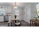 Bright dining area with modern floors, round table, and a stylish pendant light at 842 Brighton Dr, Lawrenceville, GA 30043