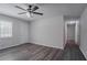 Bright room with luxury vinyl floors and a large window overlooking a hallway at 842 Brighton Dr, Lawrenceville, GA 30043