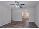 Spacious living room featuring modern vinyl floors, a ceiling fan, and an open doorway at 842 Brighton Dr, Lawrenceville, GA 30043