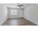 Modern living room features clean lines, a window with blinds, and sleek flooring at 842 Brighton Dr, Lawrenceville, GA 30043