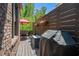 Cozy back deck features an outdoor dining set, privacy fence, and grill for outdoor relaxation at 937 E Rock Springs Ne Rd, Atlanta, GA 30306