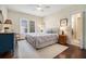 Comfortable bedroom with soft lighting, a ceiling fan and an ensuite bathroom at 937 E Rock Springs Ne Rd, Atlanta, GA 30306