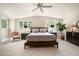 Large bedroom with two windows, neutral carpet, ceiling fan and natural light at 937 E Rock Springs Ne Rd, Atlanta, GA 30306