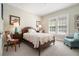Bedroom featuring a neutral color scheme, cozy seating, and natural light from the windows at 937 E Rock Springs Ne Rd, Atlanta, GA 30306