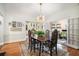 Elegant dining room featuring hardwood floors, stylish lighting, and adjacent room at 937 E Rock Springs Ne Rd, Atlanta, GA 30306
