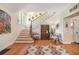 Elegant foyer featuring hardwood floors, staircase, and stylish decor at 937 E Rock Springs Ne Rd, Atlanta, GA 30306