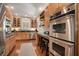 Spacious kitchen with stainless steel appliances, a breakfast bar with seating, and hardwood floors at 937 E Rock Springs Ne Rd, Atlanta, GA 30306
