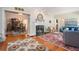 Bright, open living room with hardwood floors, fireplace, and elegant decor adjoining the dining room at 937 E Rock Springs Ne Rd, Atlanta, GA 30306