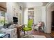Bright office featuring a built-in bookshelf, brick walls, and a large desk, perfect for working from home at 937 E Rock Springs Ne Rd, Atlanta, GA 30306