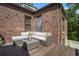 Outdoor patio with brick wall and comfortable seating at 937 E Rock Springs Ne Rd, Atlanta, GA 30306