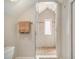 Tiled shower featuring a window and glass door at 937 E Rock Springs Ne Rd, Atlanta, GA 30306