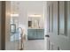 An open view of a well lit primary bathroom, showing a freestanding tub and double sink vanity at 103 St Albans Way, Peachtree City, GA 30269