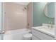 Stylish bathroom features a tub with shower, modern vanity, and gold fixtures at 103 St Albans Way, Peachtree City, GA 30269