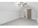This bedroom has angled ceilings, neutral carpet, a ceiling fan, and a closet at 103 St Albans Way, Peachtree City, GA 30269