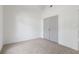 Cozy bedroom featuring neutral carpet, white walls, and closet at 103 St Albans Way, Peachtree City, GA 30269