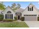 Charming one-story home with manicured lawn and attached two-car garage at 103 St Albans Way, Peachtree City, GA 30269