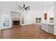 Spacious living room with vaulted ceilings, fireplace, ceiling fan, and hardwood floors at 103 St Albans Way, Peachtree City, GA 30269